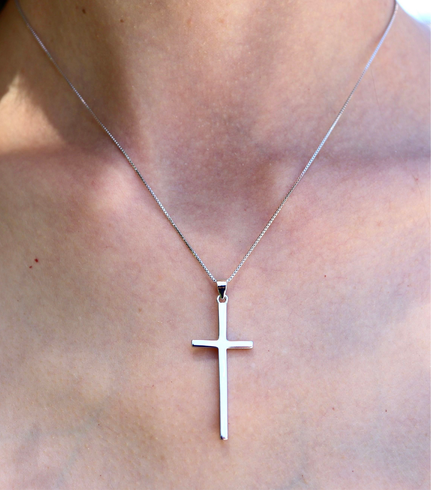 Women's high polish cross pendant